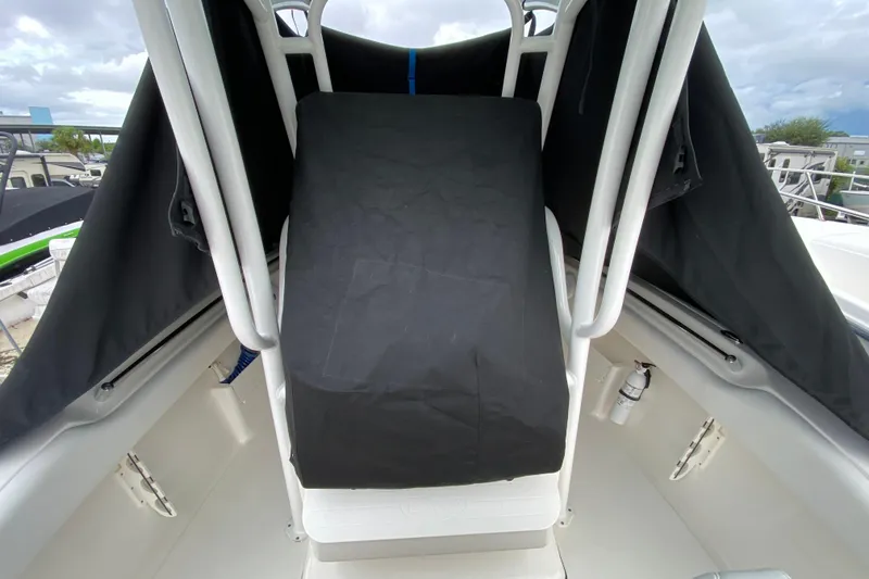 Slide: The Image of 2023 Key West 239 FS boat interior with covered console and safety equipment. - 122