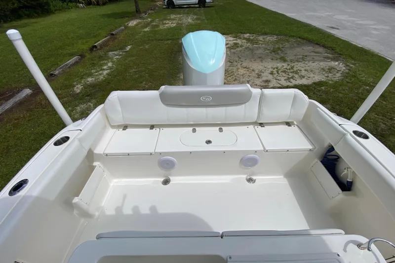 Slide: The Image of 2023 Key West 239 FS boat interior with seating and storage compartments. - 15