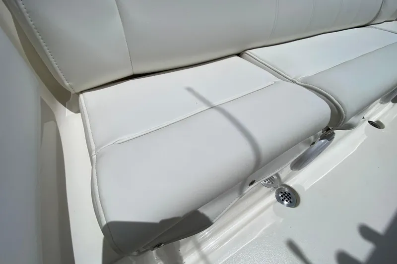 Slide: The Image of 2023 Key West 239 FS boat interior with white cushioned seating. - 20