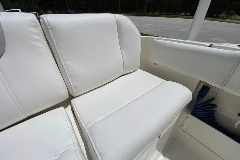 Slide: The Image of White seating on 2023 Key West 239 FS boat, showcasing comfortable marine upholstery. - 22
