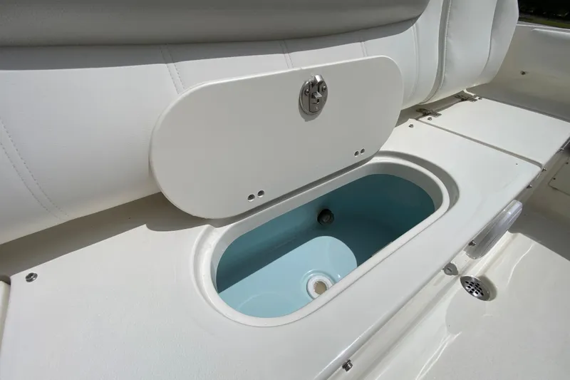 Slide: The Image of 2023 Key West 239 FS boat interior with open storage compartment. - 27