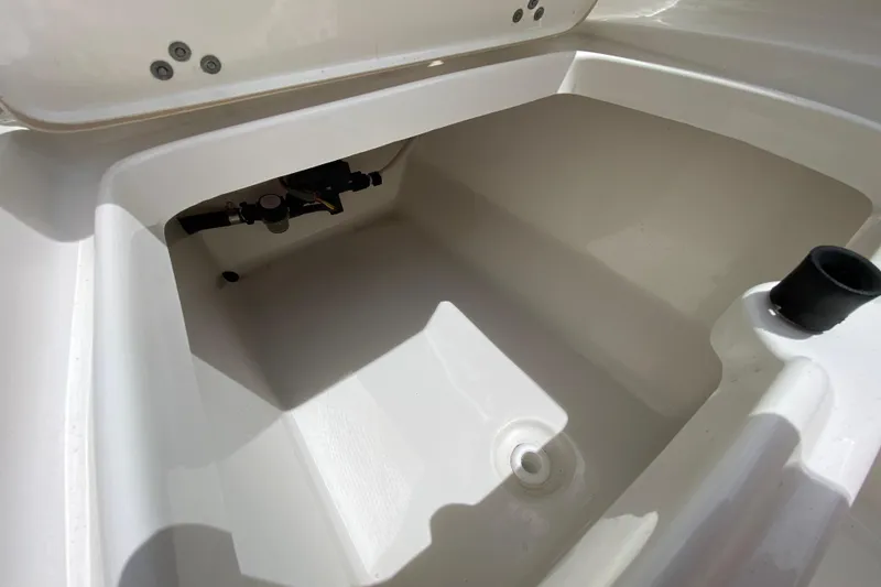 Slide: The Image of 2023 Key West 239 FS boat storage compartment, featuring a clean, spacious interior. - 31