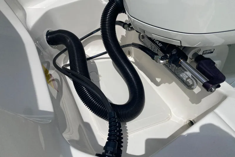 Slide: The Image of 2023 Key West 239 FS boat engine compartment with hydraulic steering and wiring. - 39