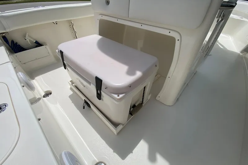 Slide: The Image of 2023 Key West 239 FS boat interior with storage compartment and cooler. - 43
