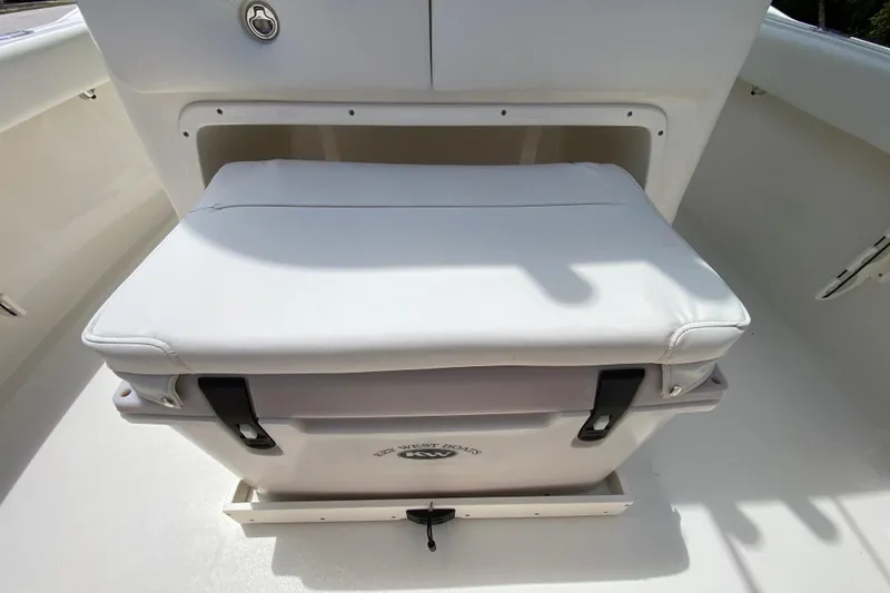Slide: The Image of 2023 Key West 239 FS boat seat with integrated cooler, white upholstery. - 45