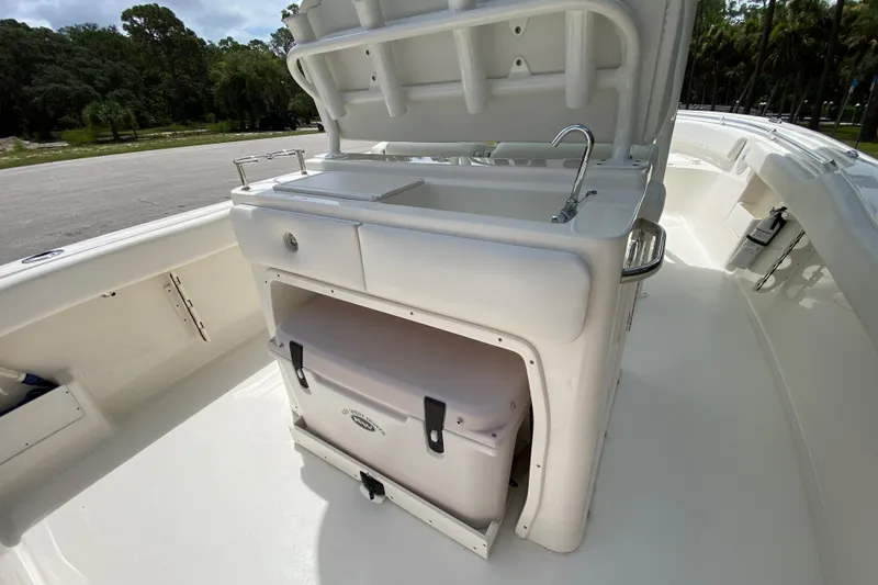 Slide: The Image of 2023 Key West 239 FS boat interior with sink and storage compartment. - 48