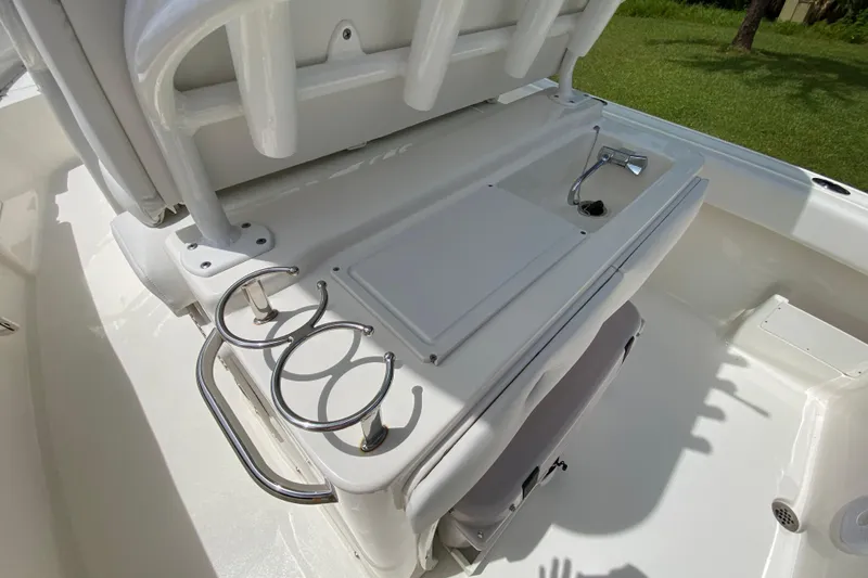 Slide: The Image of 2023 Key West 239 FS boat interior with seating and cup holders. - 50