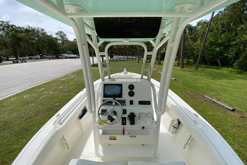 Slide: The Image of 2023 Key West 239 FS boat interior with steering console and navigation system. - 54