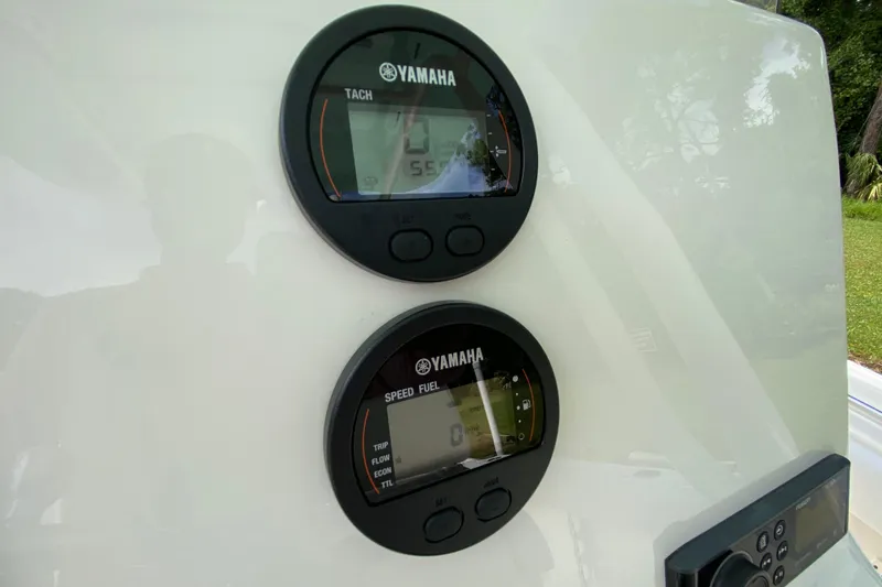 Slide: The Image of Yamaha gauges on 2023 Key West 239 FS boat dashboard, displaying tachometer and speed fuel data. - 61