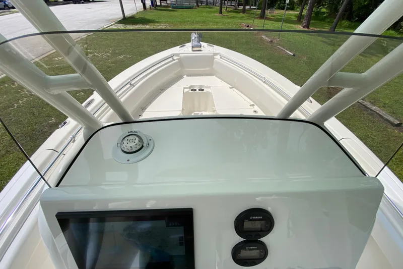 Slide: The Image of 2023 Key West 239 FS boat dashboard with navigation instruments and controls. - 62