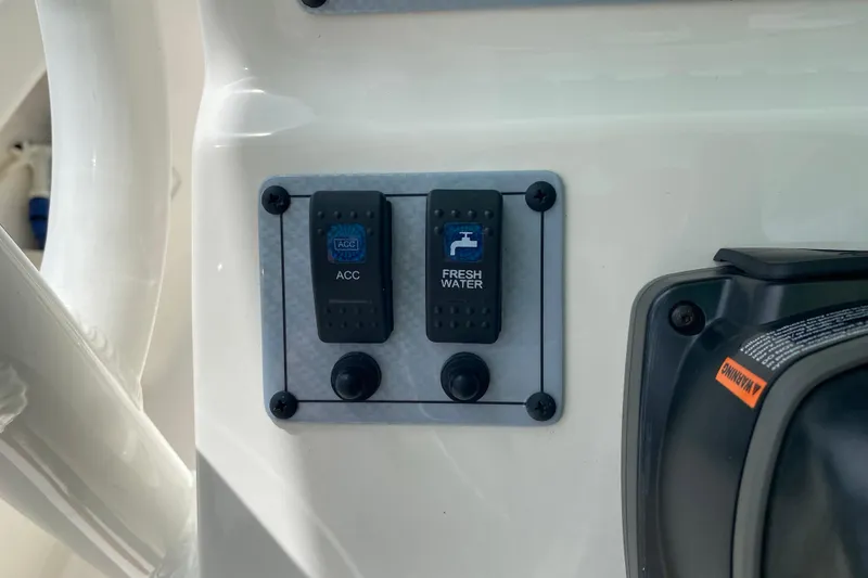 Slide: The Image of Control panel on 2023 Key West 239 FS boat with accessory and fresh water switches. - 64