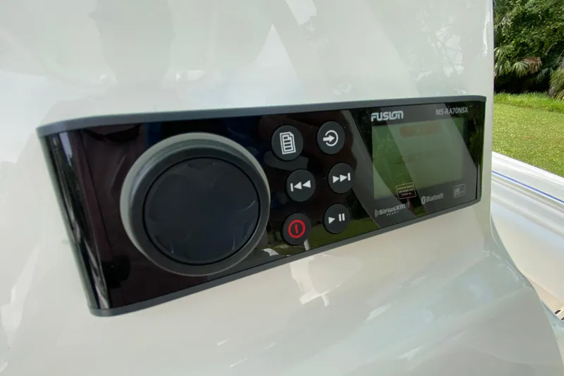 Slide: The Image of 2023 Key West 239 FS boat stereo system with control panel and display. - 67