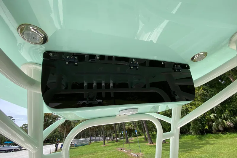 Slide: The Image of 2023 Key West 239 FS boat console with sleek black panel and integrated lighting. - 75