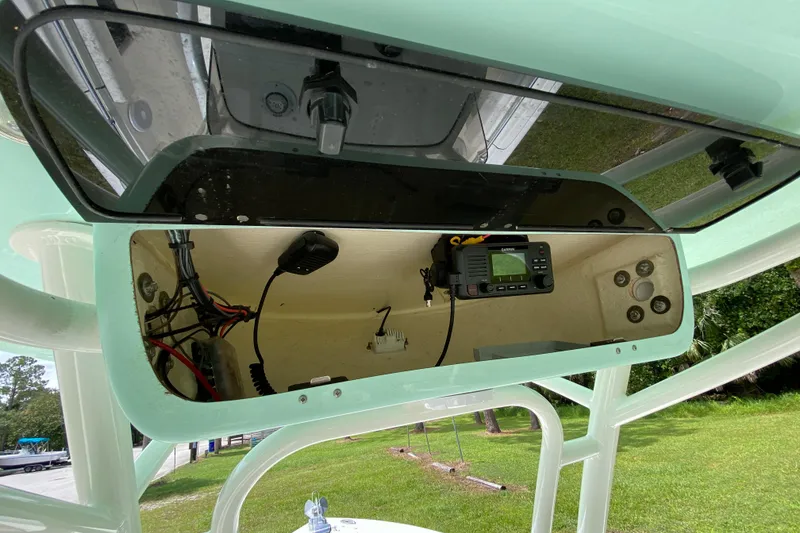 Slide: The Image of 2023 Key West 239 FS boat console with electronic equipment and wiring. - 76