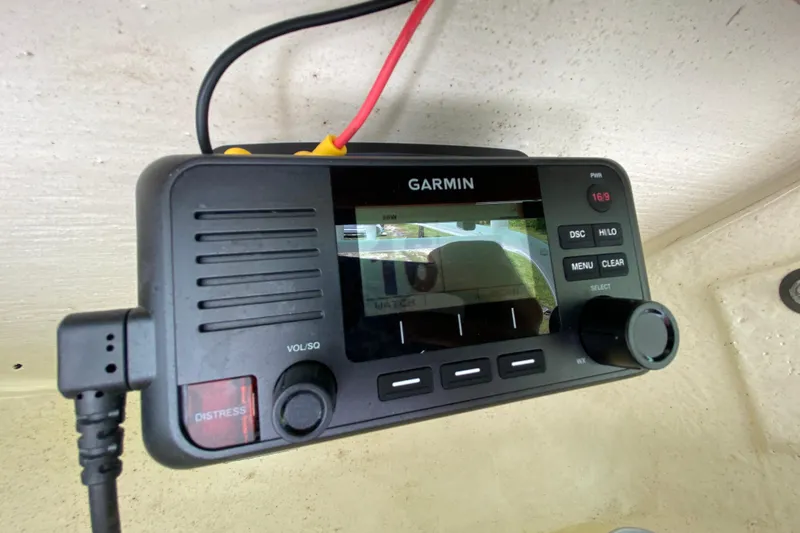 Slide: The Image of Garmin marine radio on 2023 Key West 239 FS boat dashboard. - 77