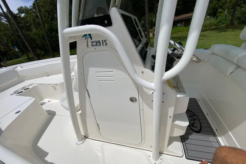Slide: The Image of 2023 Key West 239 FS boat interior with console and seating area. - 82