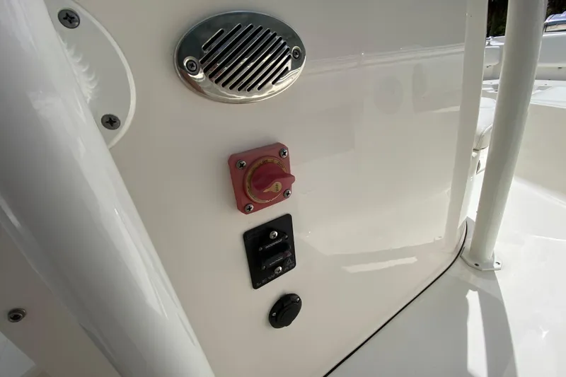 Slide: The Image of 2023 Key West 239 FS boat control panel with switches and speaker. - 84
