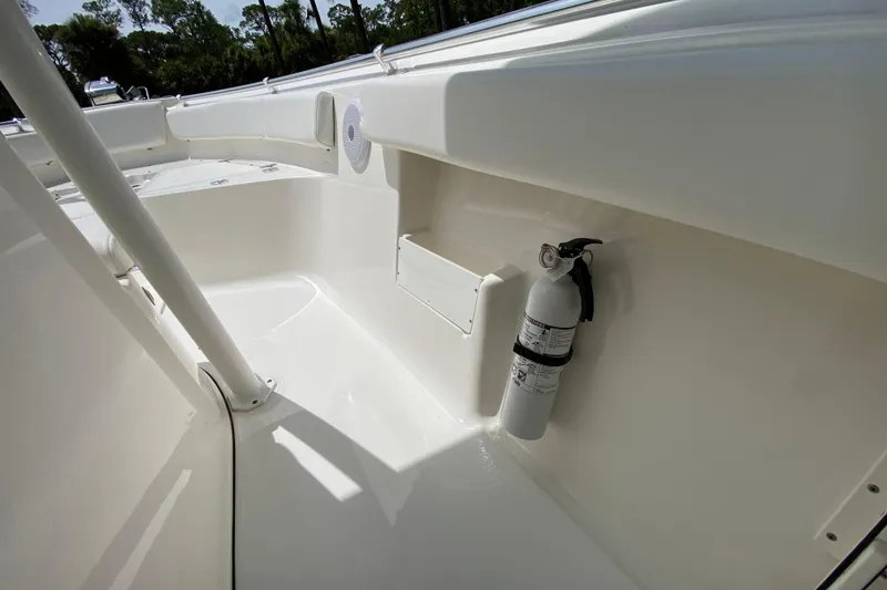Slide: The Image of 2023 Key West 239 FS boat interior with fire extinguisher and seating area. - 85