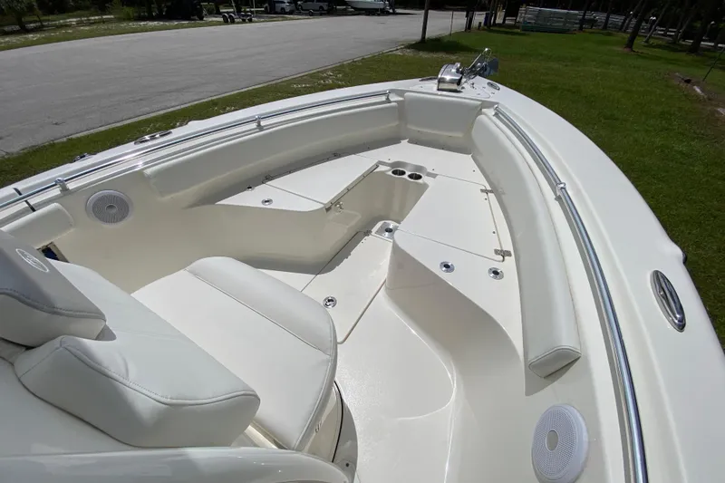 Slide: The Image of 2023 Key West 239 FS boat interior with seating and storage compartments. - 86