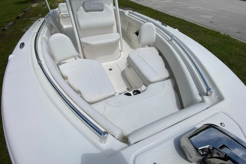 Slide: The Image of 2023 Key West 239 FS boat interior with white seating and sleek design. - 90