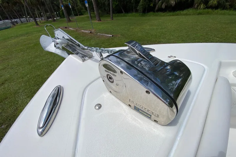 Slide: The Image of 2023 Key West 239 FS boat anchor system on deck, featuring polished metal components. - 91