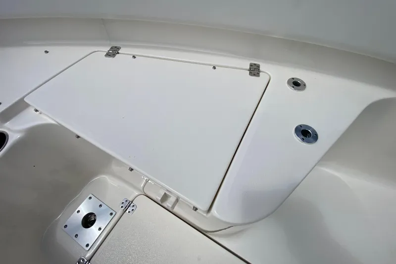 Slide: The Image of 2023 Key West 239 FS boat deck with storage compartment and metal fittings. - 92