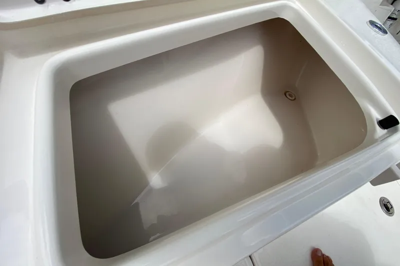Slide: The Image of Livewell compartment on 2023 Key West 239 FS boat, featuring a clean, spacious interior. - 94