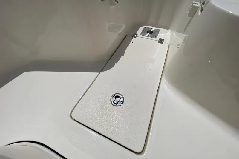 Slide: The Image of 2023 Key West 239 FS boat storage compartment with secure latch. - 98