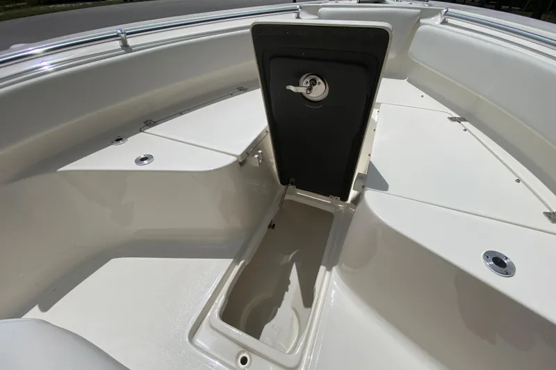 Slide: The Image of 2023 Key West 239 FS boat interior with open storage compartment. - 99