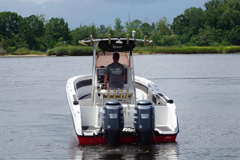 Slide: The Image of 2006 Seaswirl Striper 2601 boat with dual engines on a calm river. - 5