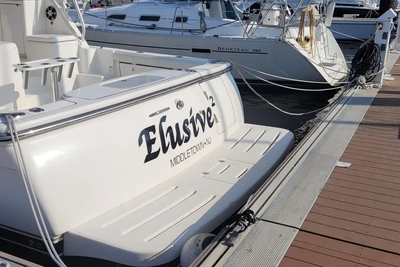 Slide: The Image of 2006 Tiara Yachts 4200 Open docked, featuring "Elusive" nameplate, Middletown, NJ. - 11