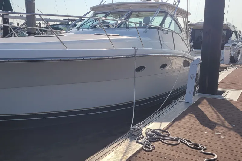 Slide: The Image of 2006 Tiara Yachts 4200 Open docked at marina, side view. - 15