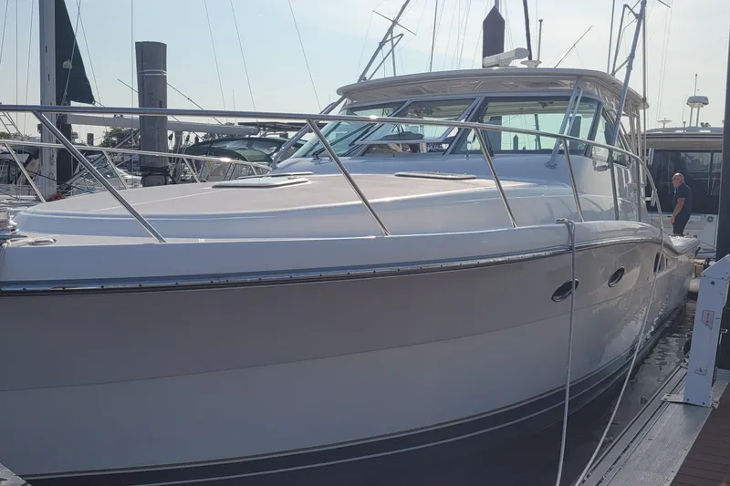 Slide: The Image of 2006 Tiara Yachts 4200 Open docked at marina, sleek design and polished exterior. - 16