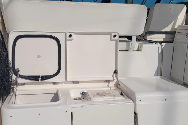 Slide: The Image of 2006 Tiara Yachts 4200 Open cockpit with storage compartments and seating. - 19