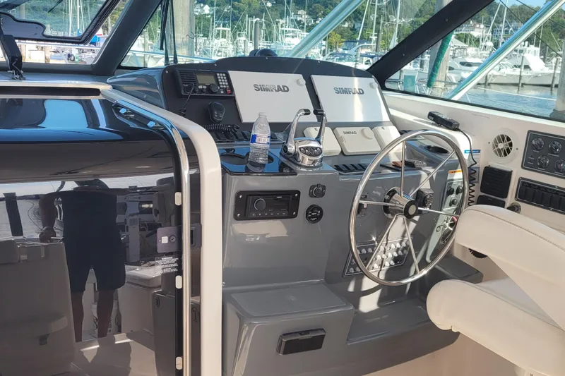 Slide: The Image of 2006 Tiara Yachts 4200 Open helm with Simrad electronics and steering wheel. - 24