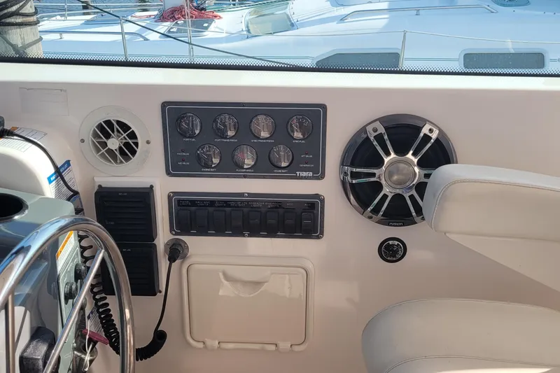 Slide: The Image of Control panel of a 2006 Tiara Yachts 4200 Open with gauges and speaker. - 32
