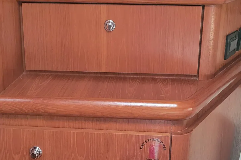 Slide: The Image of Wooden cabinetry on a 2006 Tiara Yachts 4200 Open, featuring sleek design and storage. - 46