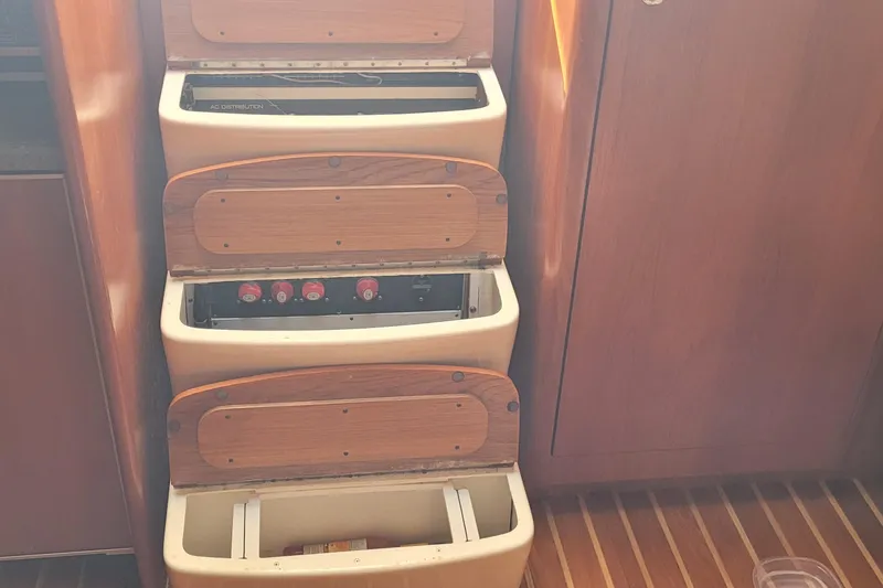 Slide: The Image of 2006 Tiara Yachts 4200 Open interior with wooden storage compartments and control panel. - 52