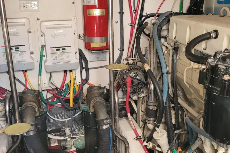 Slide: The Image of Engine room of a 2006 Tiara Yachts 4200 Open, showcasing wiring and machinery. - 61