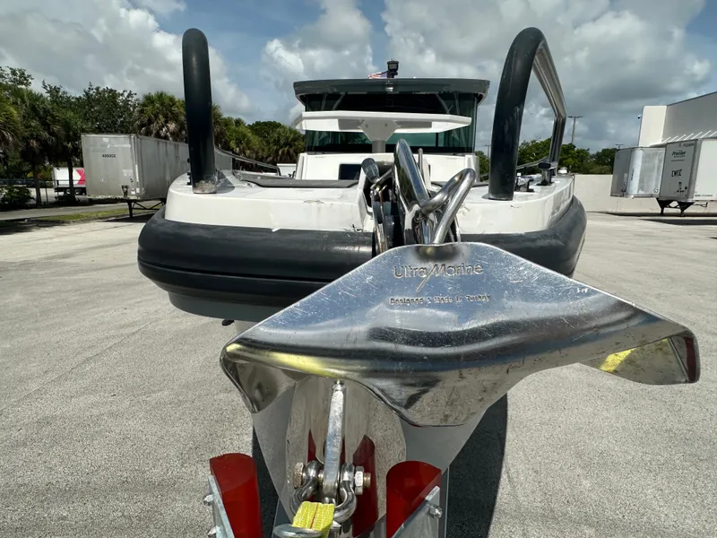 Slide: The Image of Axopar 37 XC CROSS CABIN 2020 with Ultra Marine anchor, parked outdoors. - 13