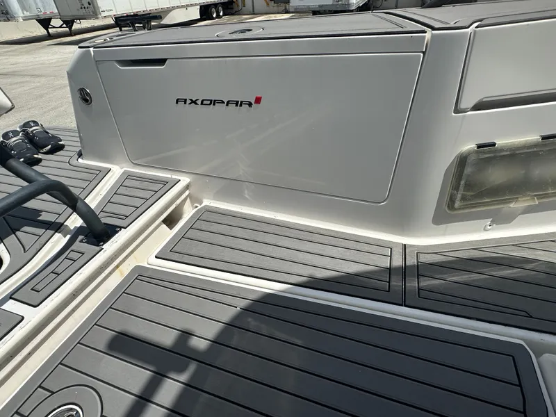 Slide: The Image of Axopar 37 XC CROSS CABIN 2020 boat deck with sleek design and branding. - 18