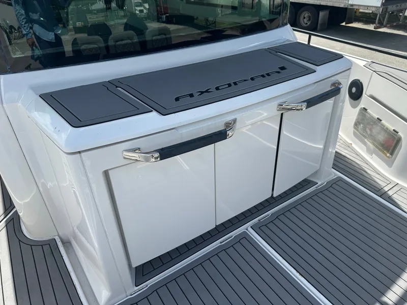 Slide: The Image of 2020 Axopar 37 XC CROSS CABIN rear deck with storage compartments. - 20