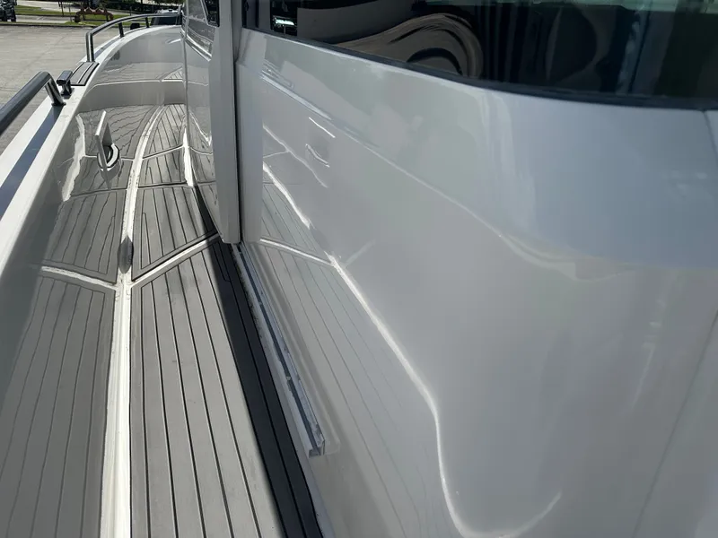 Slide: The Image of Axopar 37 XC CROSS CABIN 2020, sleek side deck view with modern design. - 23