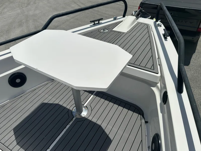 Slide: The Image of 2020 Axopar 37 XC CROSS CABIN boat deck with table and seating area. - 29