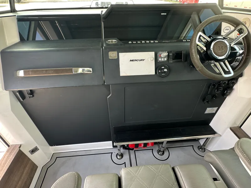 Slide: The Image of 2020 Axopar 37 XC CROSS CABIN helm with Mercury controls and steering wheel. - 33