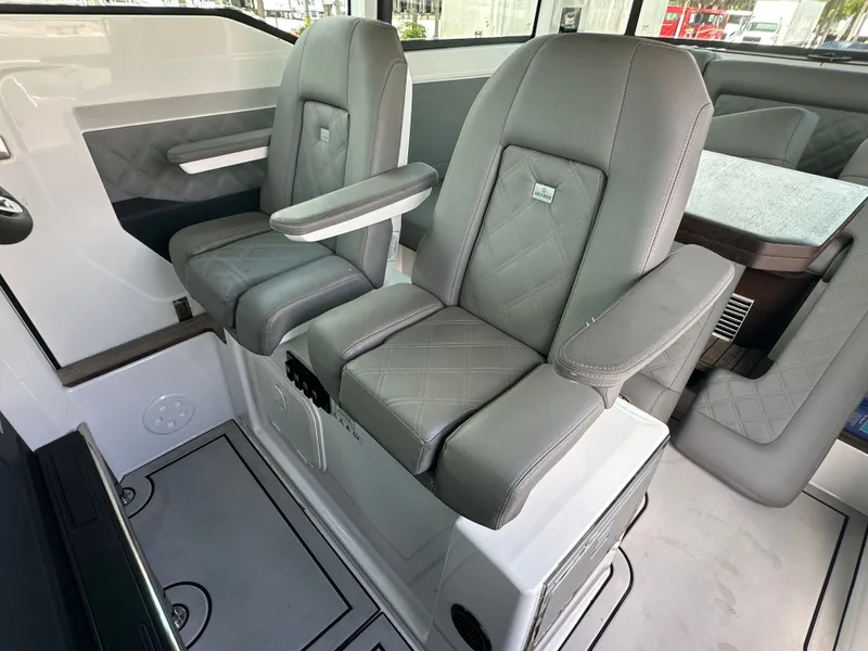 Slide: The Image of Luxurious seating in 2020 Axopar 37 XC CROSS CABIN with quilted gray upholstery. - 34