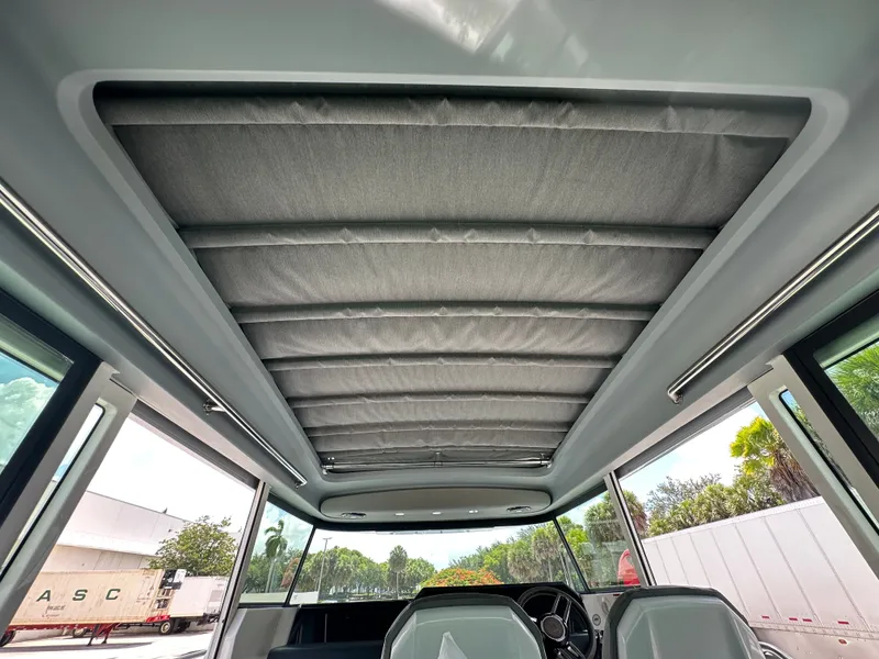 Slide: The Image of Interior view of 2020 Axopar 37 XC CROSS CABIN with sunroof and modern design. - 38