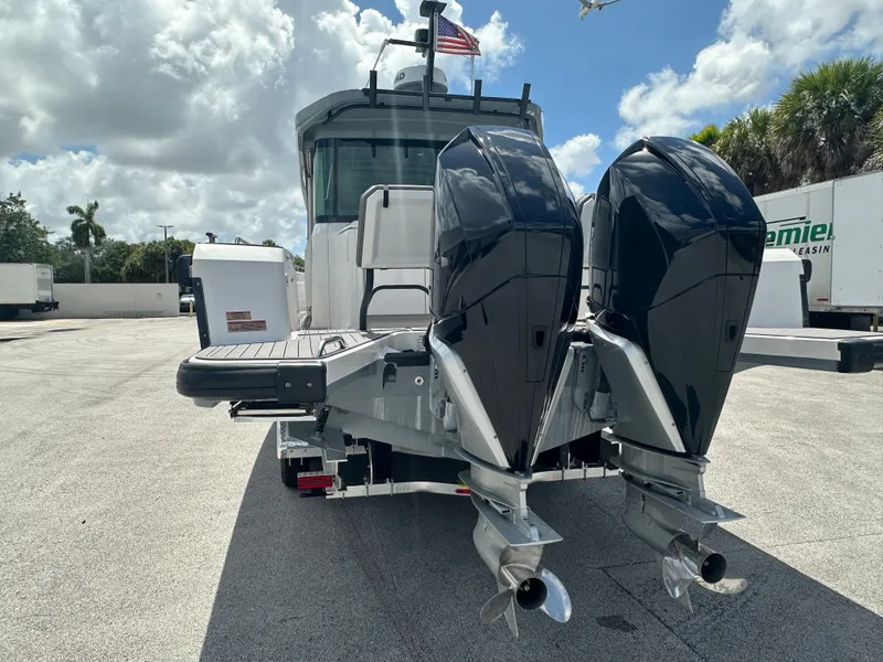Slide: The Image of 2020 Axopar 37 XC CROSS CABIN with dual outboard engines, rear view. - 4