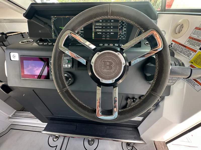 Slide: The Image of Steering wheel and dashboard of 2020 Axopar 37 XC CROSS CABIN boat. - 45
