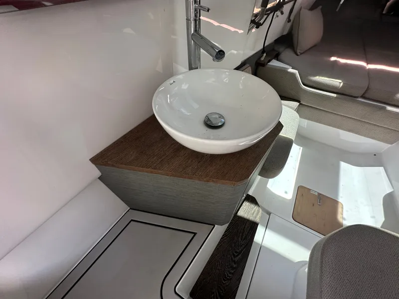 Slide: The Image of Modern interior of 2020 Axopar 37 XC CROSS CABIN with stylish sink and seating area. - 46